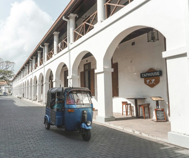 Provisional Architecture & Design photograph: a white arcaded building with repeating columns.